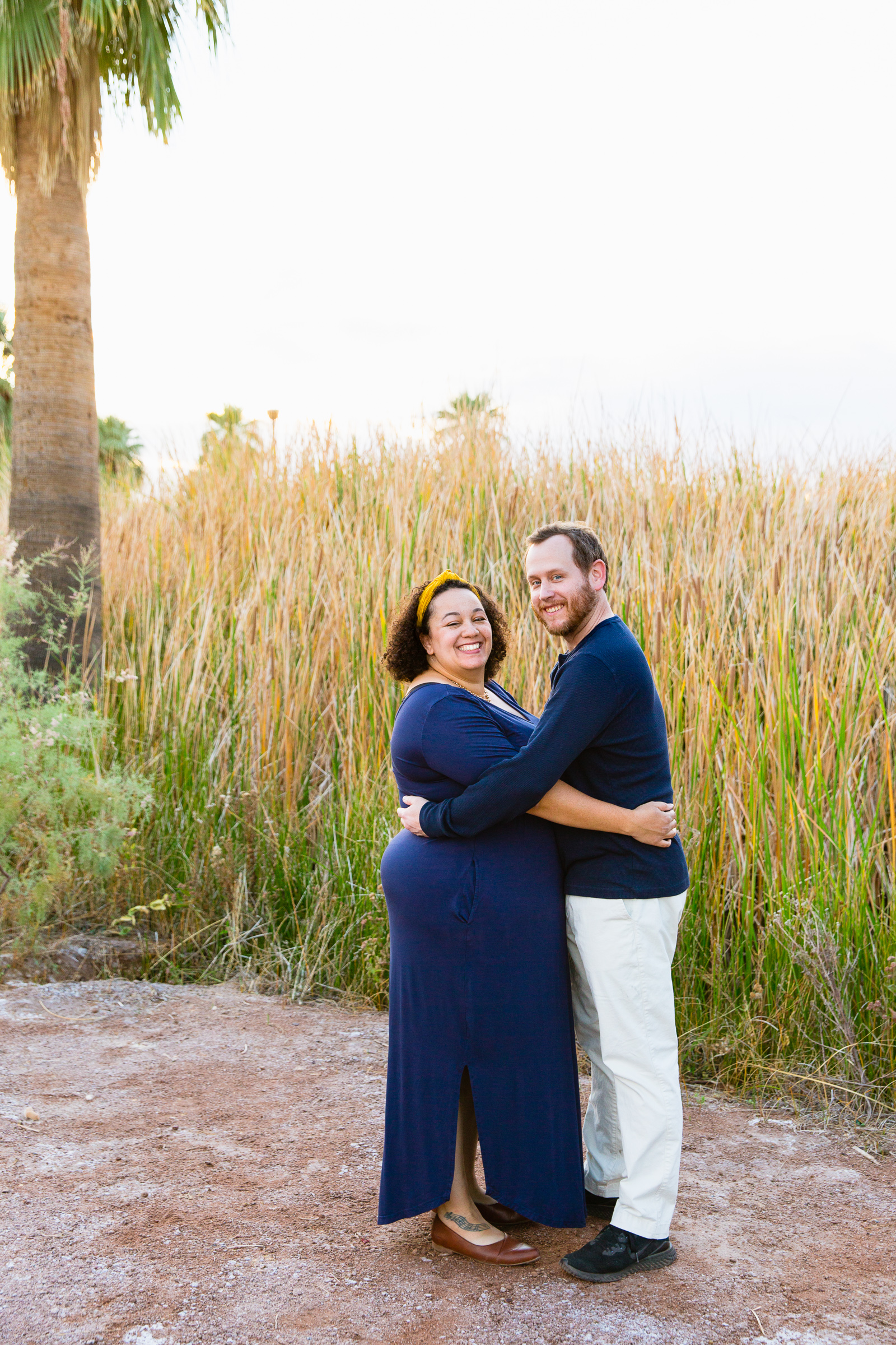 Parents pose together during their Papago Park family session by Phoenix family photographer PMA Photography.