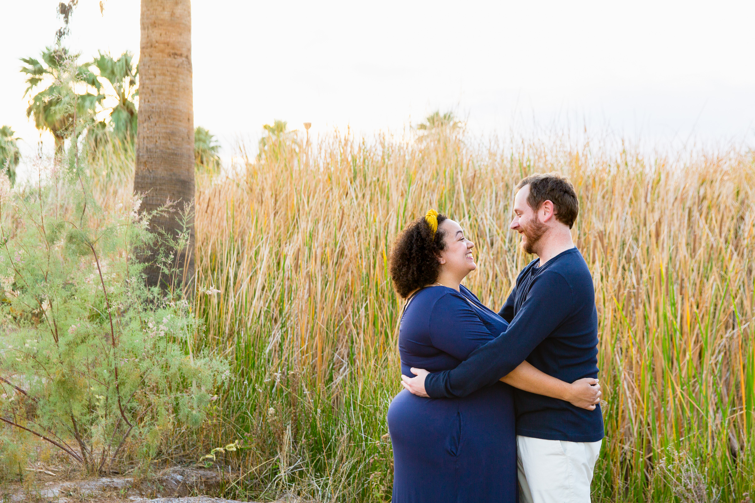 Parents pose together during their Papago Park family session by Phoenix family photographer PMA Photography.