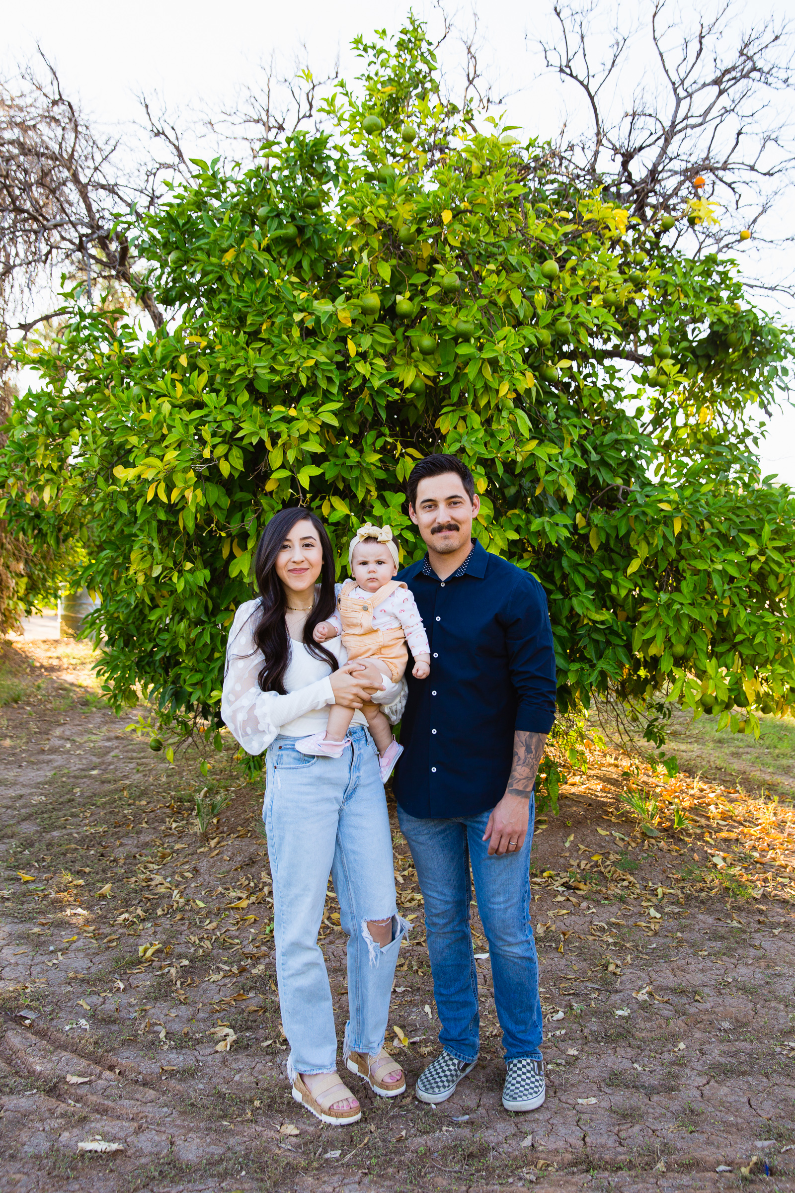 Family pose for their Sahuaro Ranch family session by Glendale family photographer PMA Photography.