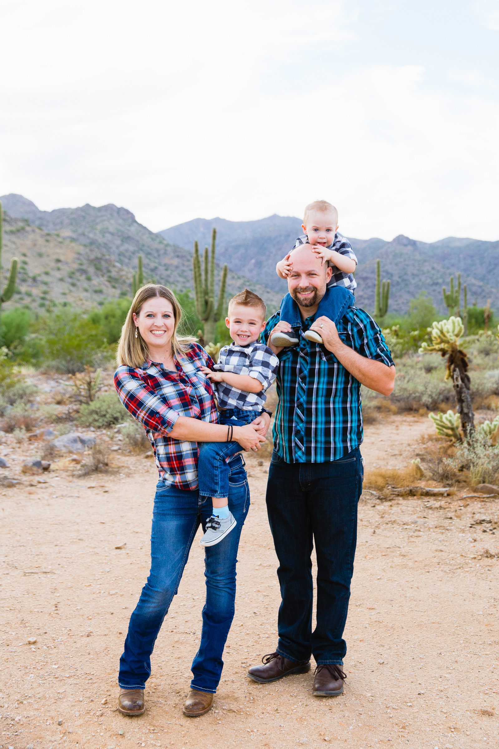 Family pose during their Waddell family session by Arizona family photographer PMA Photography.