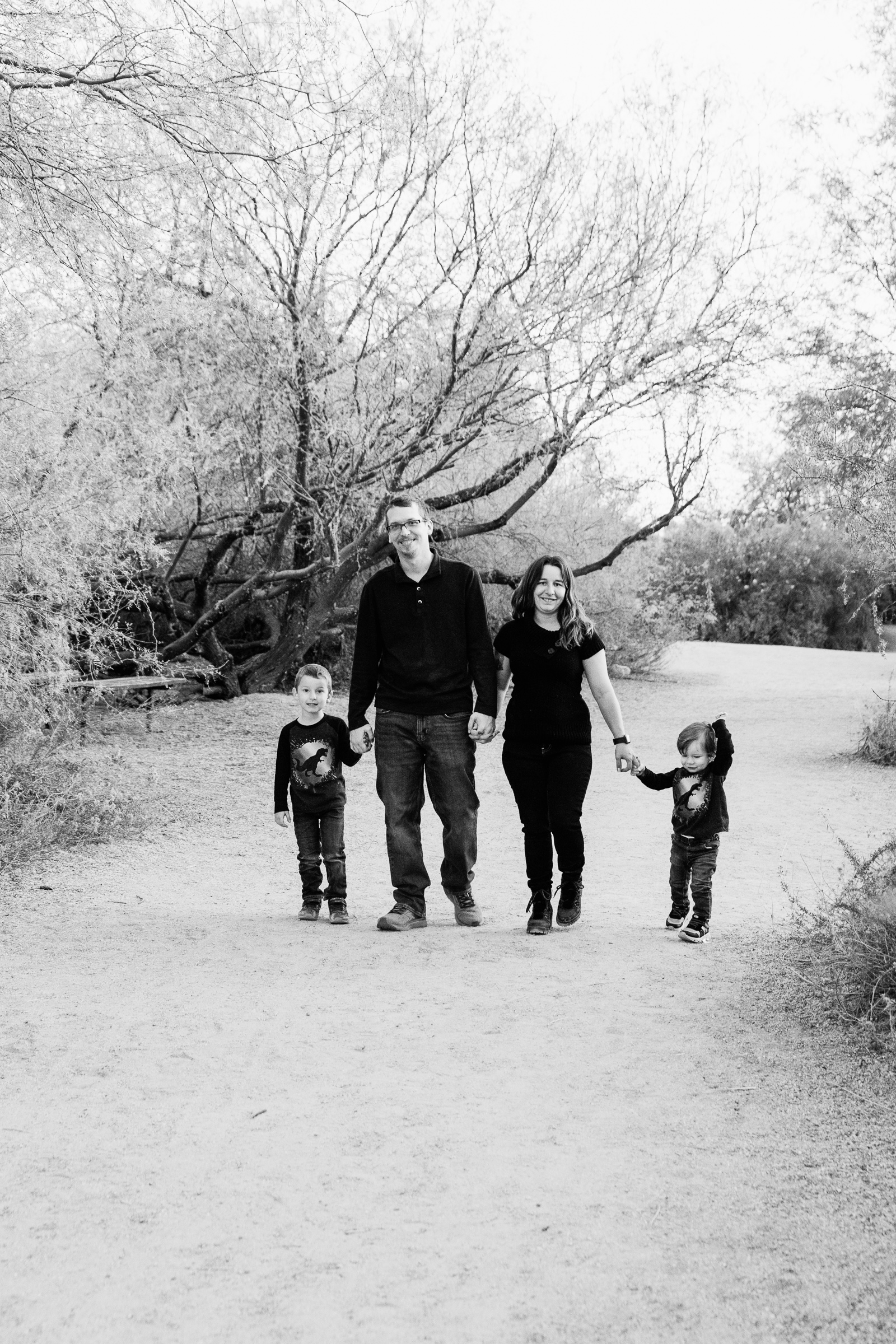 Family walking together during their Gilbert family session by Arizona family photographer PMA Photography.