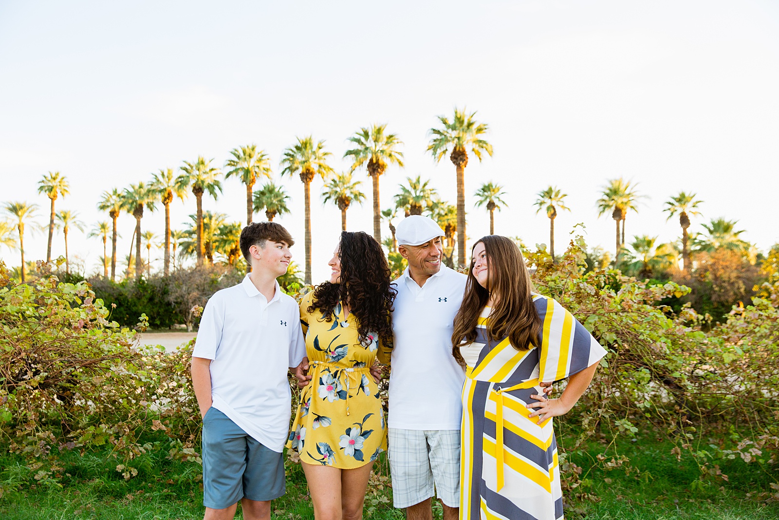 Family having fun together at their Sahuaro Ranch family session by Glendale family photographer PMA Photography.