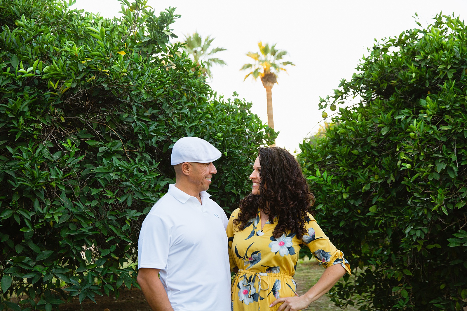 Parents pose together during their Sahuaro Ranch family session by Glendale family photographer PMA Photography.