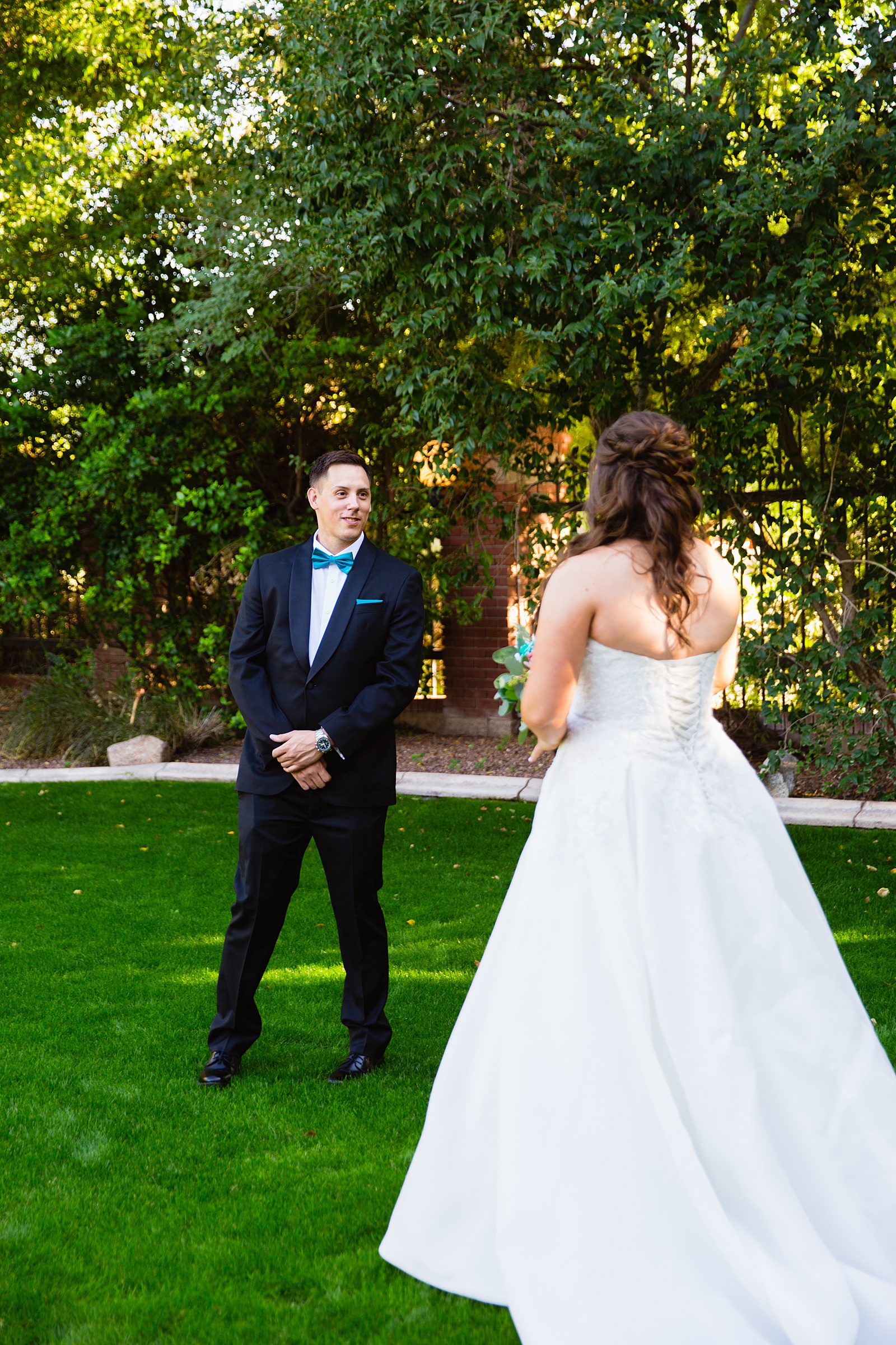Bride and groom's first look at Stonebridge Manor by Phoenix wedding photographer PMA Photography.