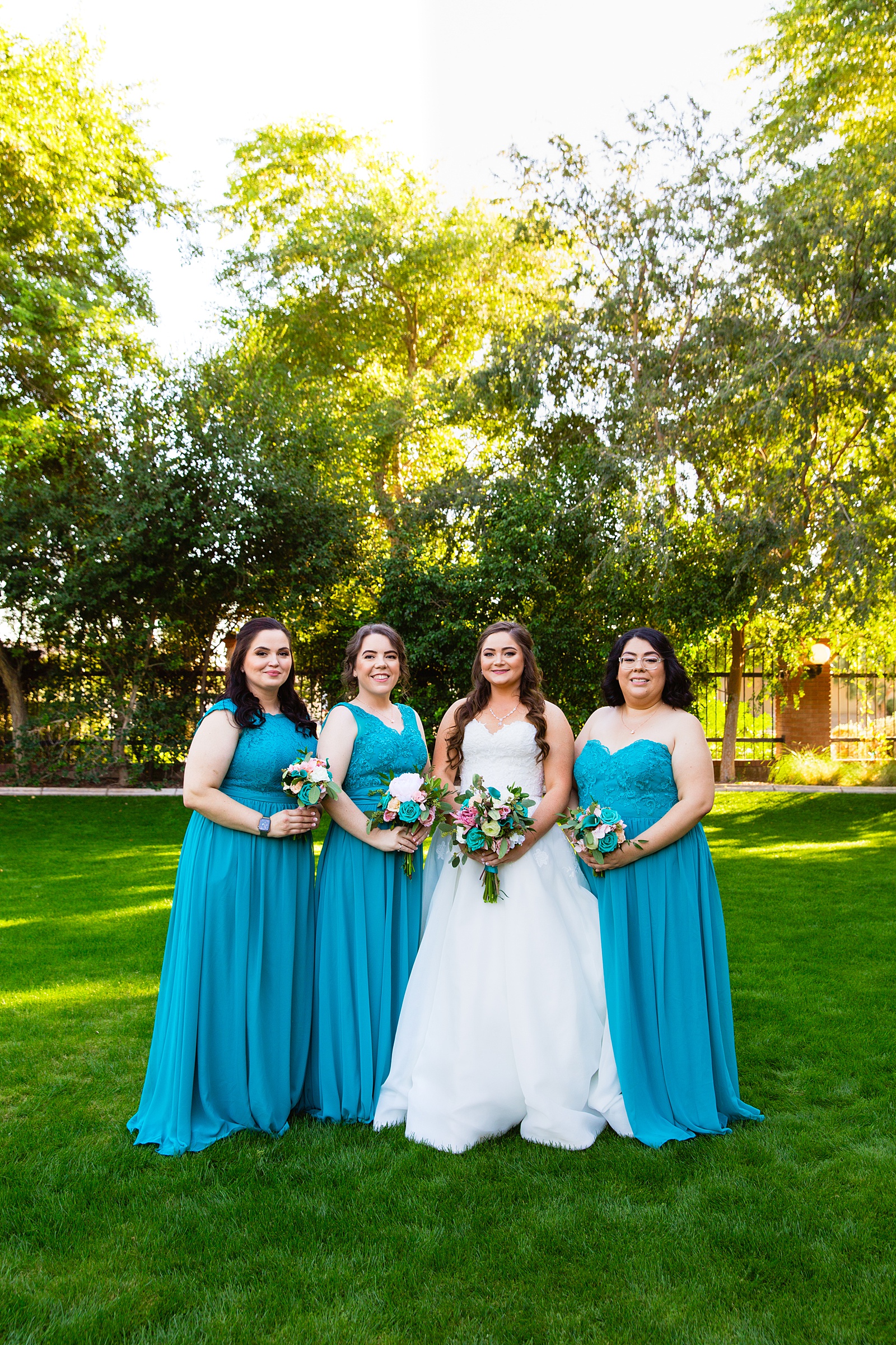 Bride and bridesmaids together at a Stonebridge Manor wedding by Arizona wedding photographer PMA Photography.