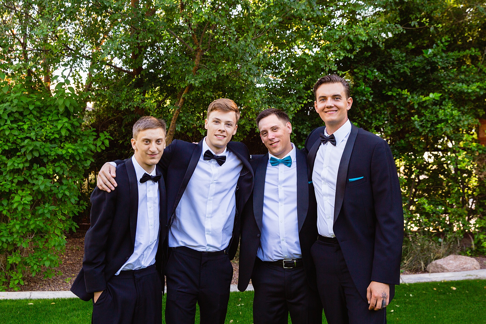 Groom and groomsmen together at a Stonebridge Manor wedding by Arizona wedding photographer PMA Photography.