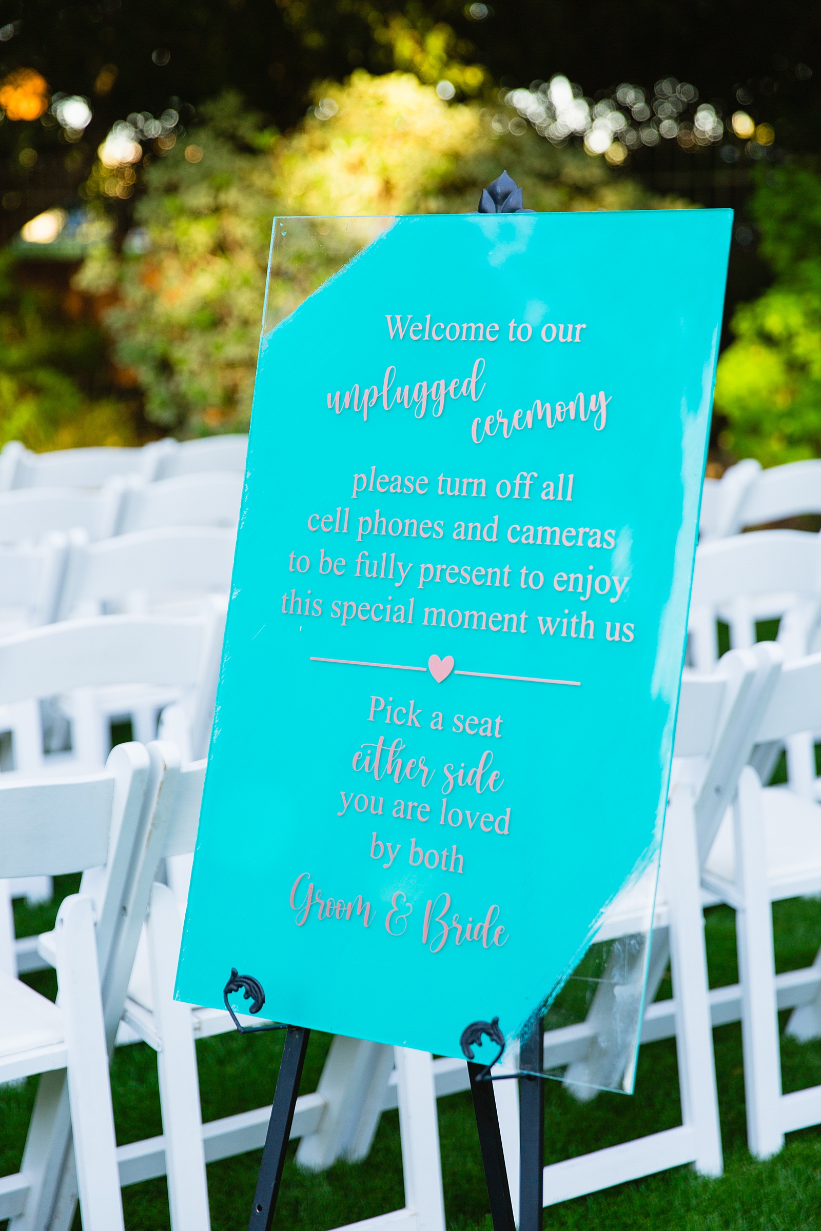 Teal and rose gold unplugged ceremony sign at a Stonebridge Manor wedding by PMA Photography.