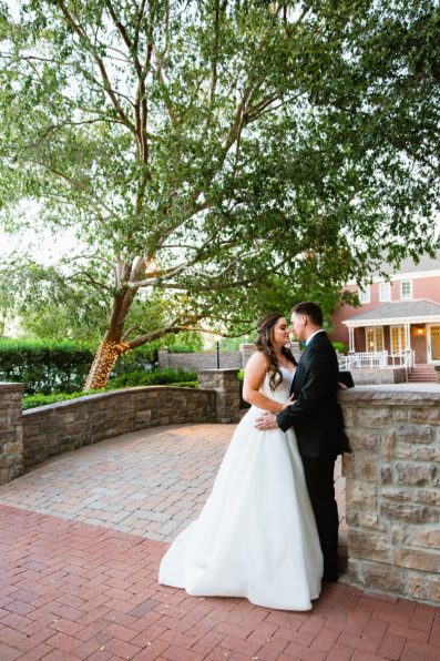 Bride and groom share an intimate moment during their Stonebridge Manor wedding by Mesa wedding photographer PMA Photography.