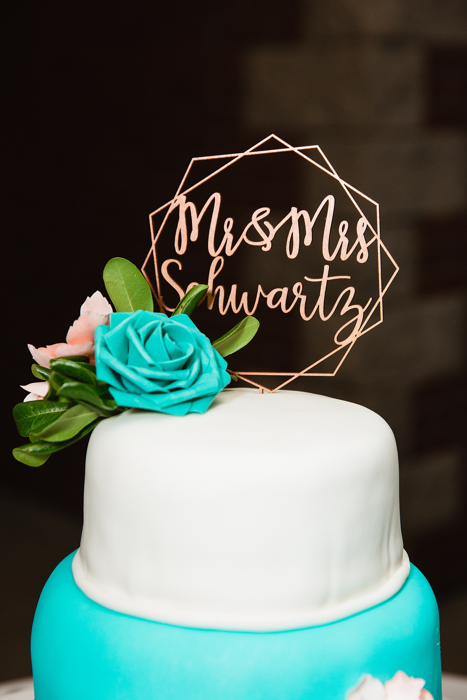 Modern rose gold, custom wedding cake topper with "Mr and Mrs" by Arizona wedding photographer PMA Photography.
