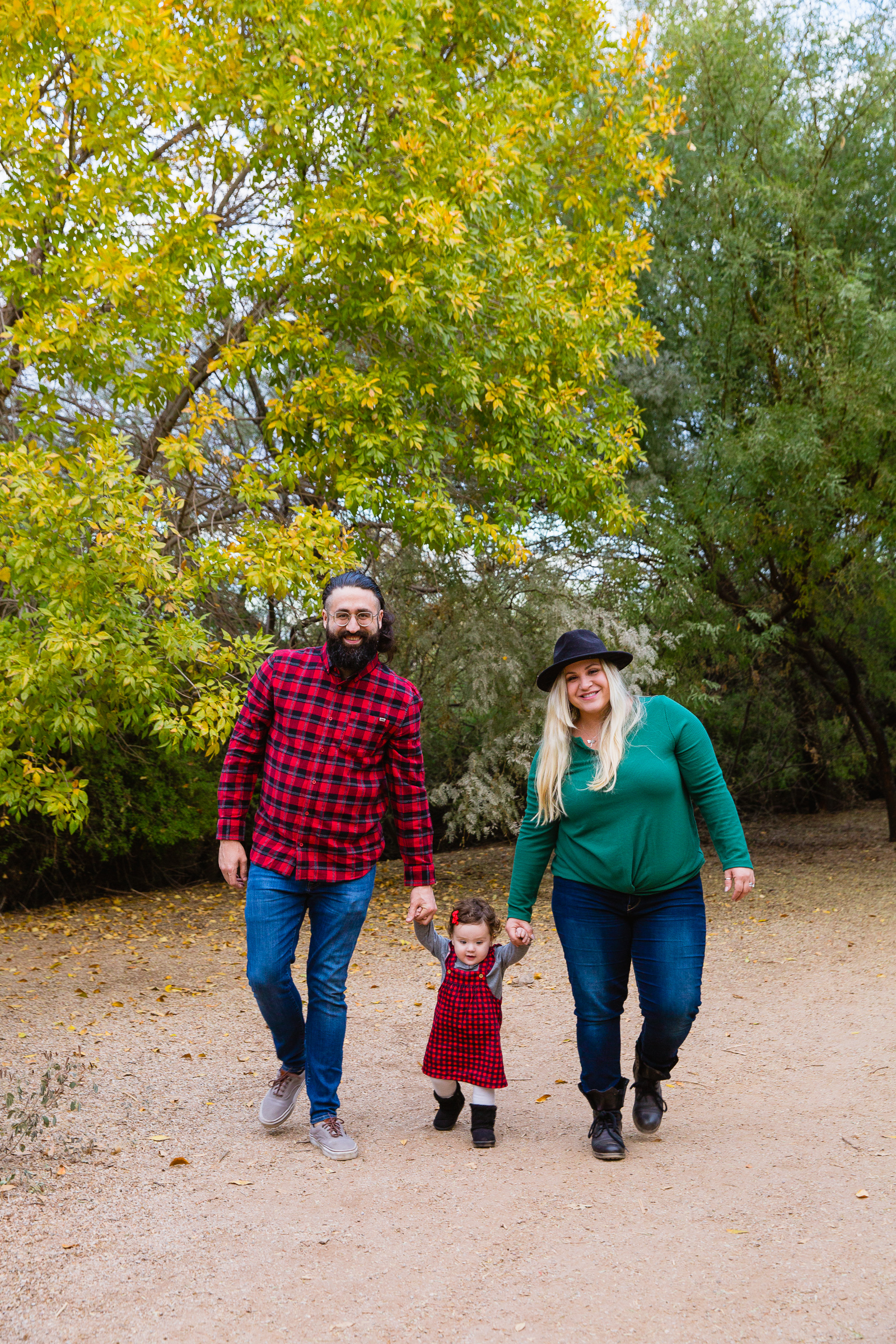 Family walking together during their Riparian Preserve at Water Ranch family session by Gilbert family photographer PMA Photography.
