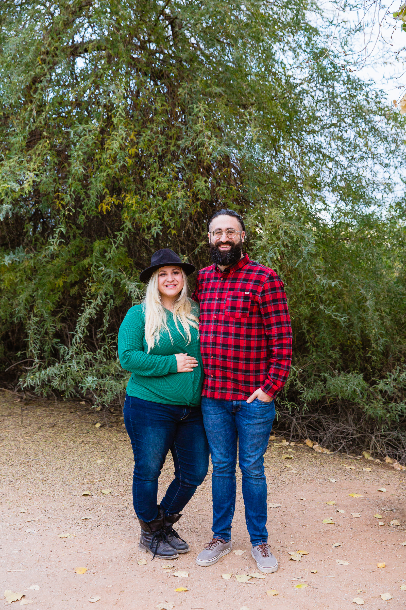Parents pose together during their Riparian Preserve at Water Ranch family session by Gilbert family photographer PMA Photography.