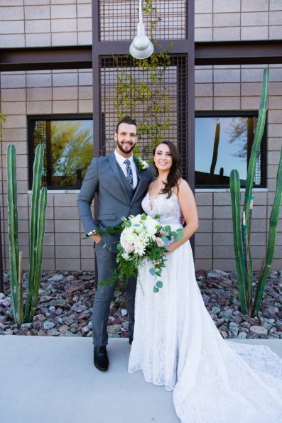 Bride and groom pose during their Papago Events wedding by Arizona wedding photographer PMA Photography.