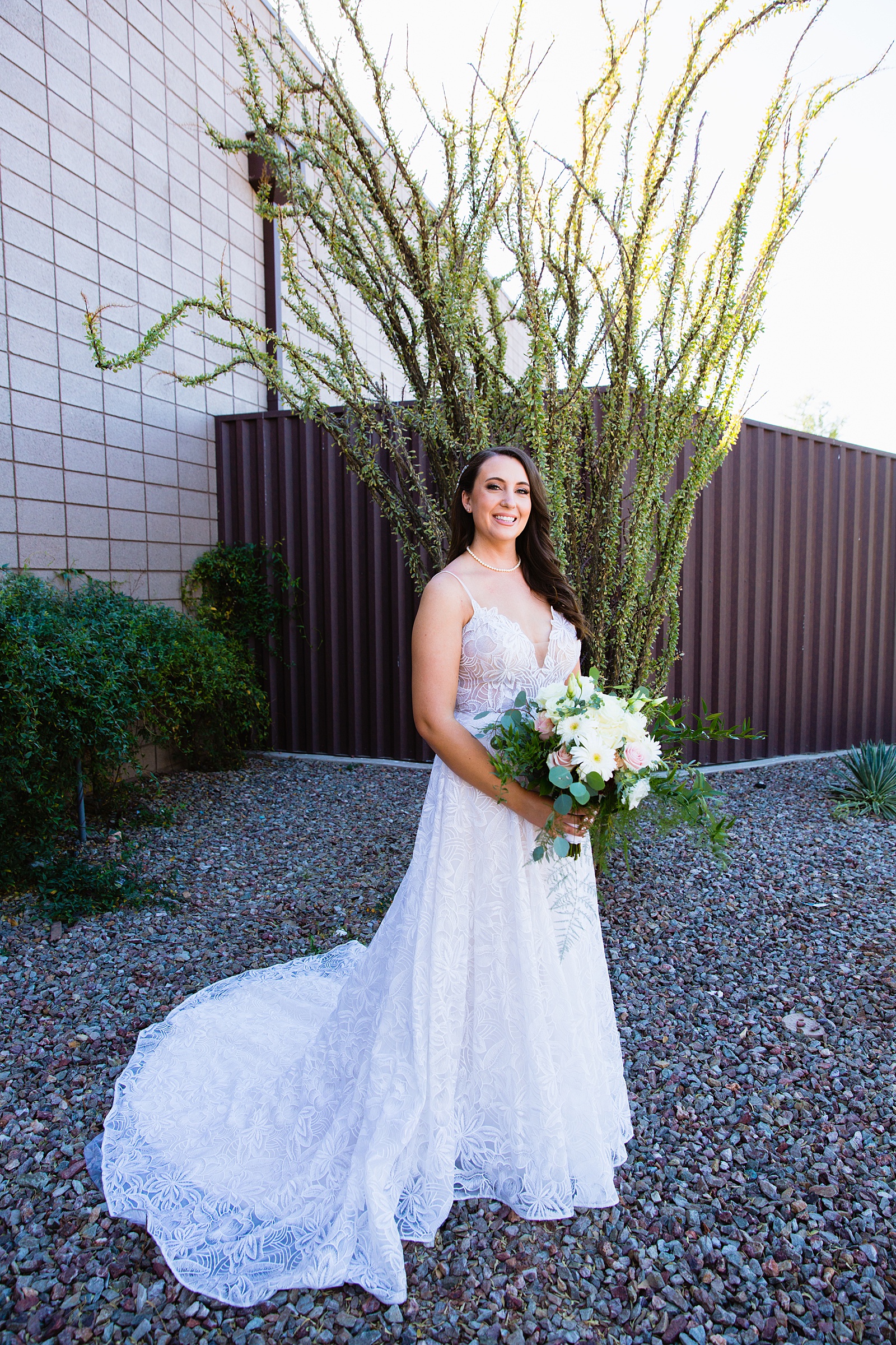 Bride's romantic lace wedding dress for her Papago Events wedding by PMA Photography.