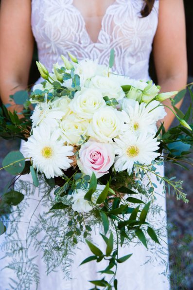 Bride's wild boho cream and blush wedding bouquet by Arizona wedding photographer PMA Photography.