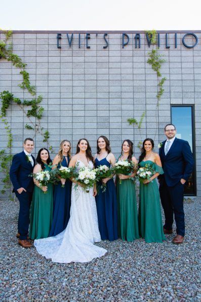 Bride and mixed gender bridal party together at a Papago Events wedding by Arizona wedding photographer PMA Photography.
