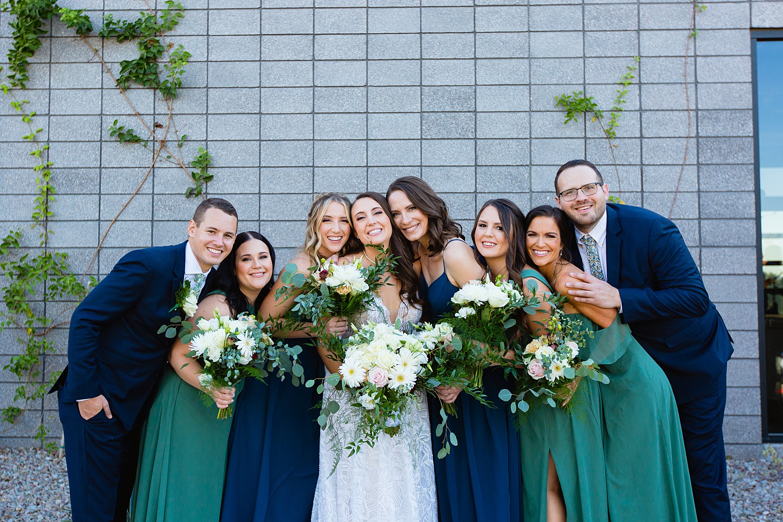 Bride and mixed gender bridal party together at a Papago Events wedding by Arizona wedding photographer PMA Photography.