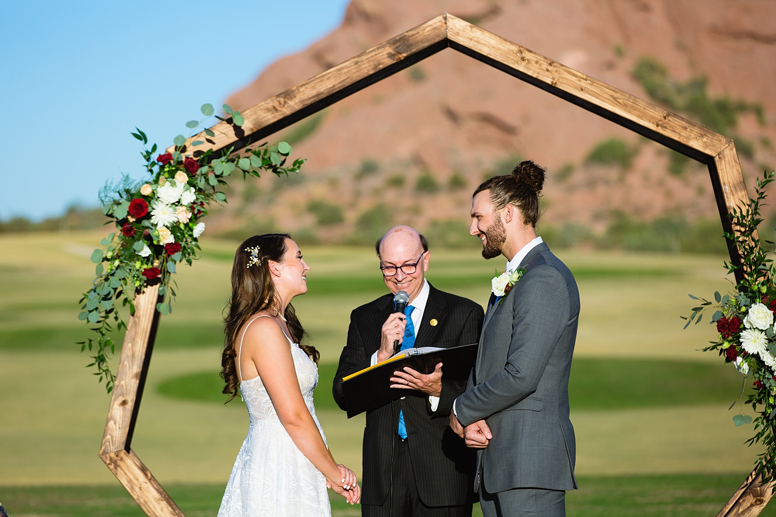 Bride and groom togethering during Papago Events wedding ceremony by Phoenix wedding photographer PMA Photography.