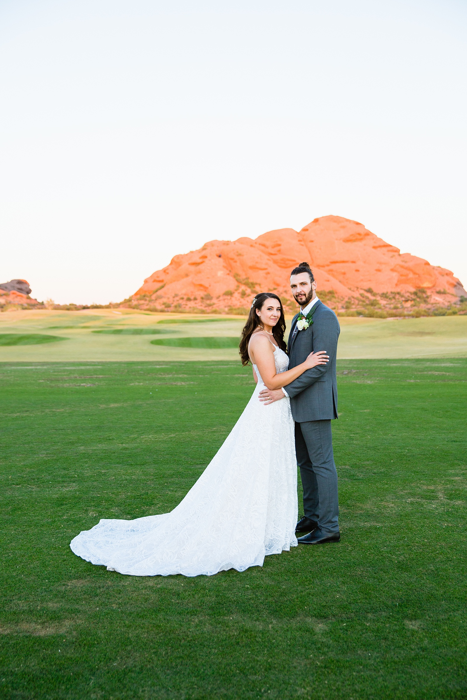 Bride and groom pose during their Papago Events wedding by Arizona wedding photographer PMA Photography.