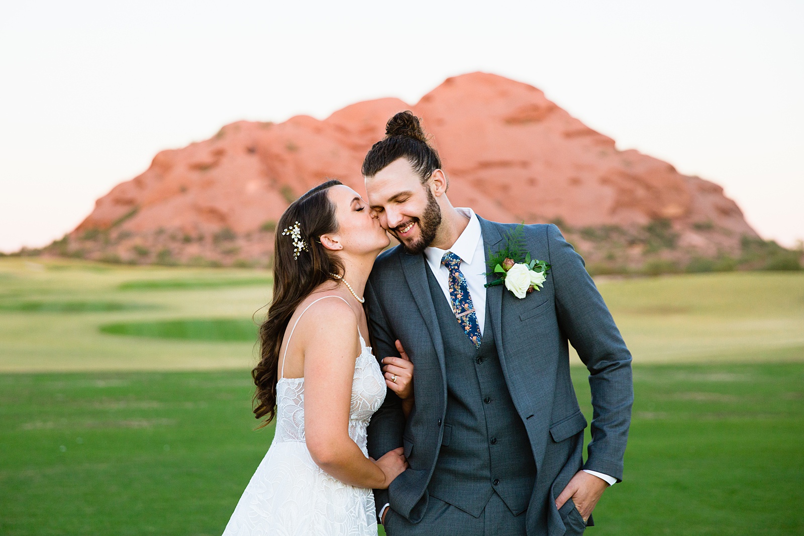 Bride and groom share a kiss during their Papago Events wedding by Phoenix wedding photographer PMA Photography.