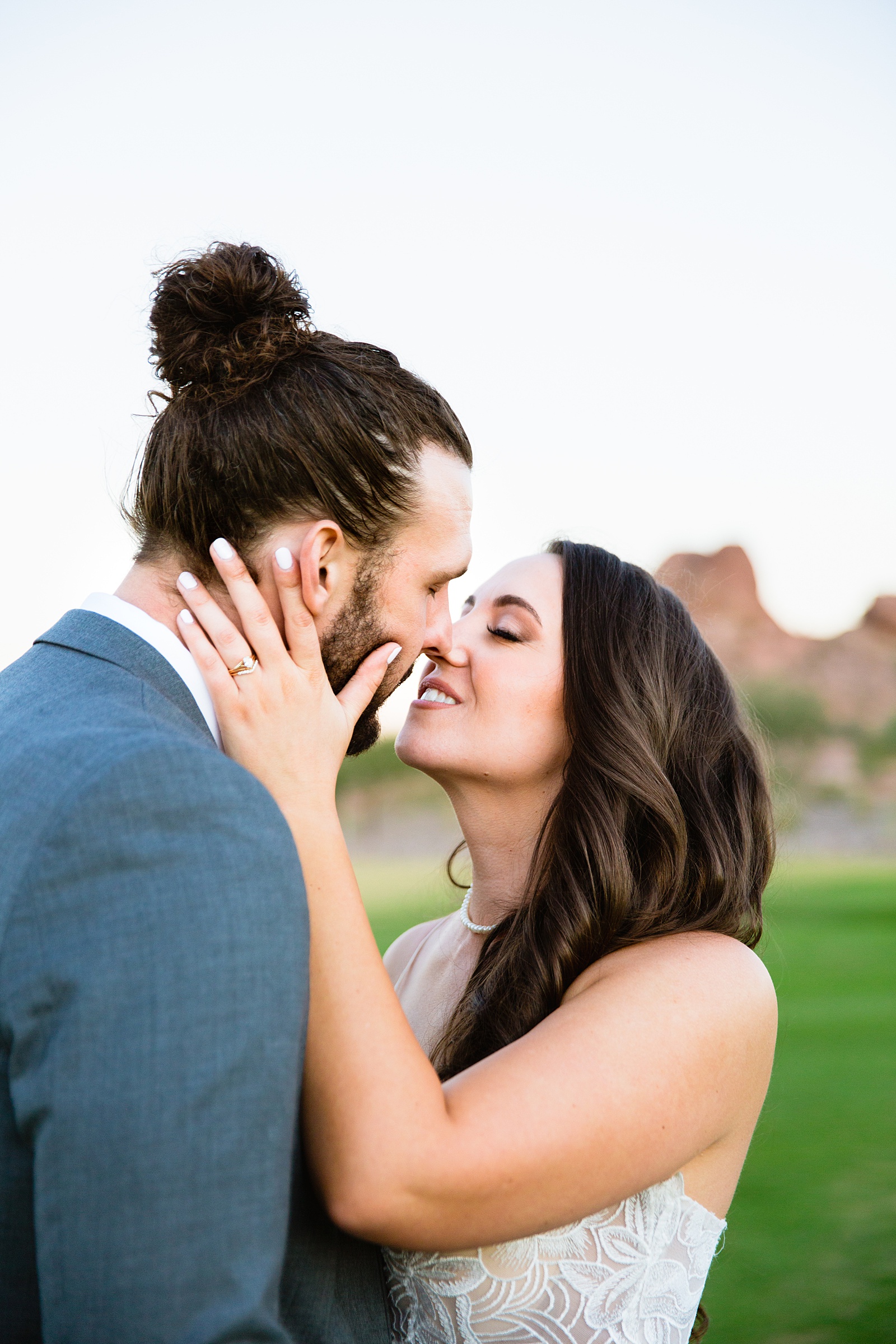 Bride and groom share an intimate moment during their Papago Events wedding by Phoenix wedding photographer PMA Photography.