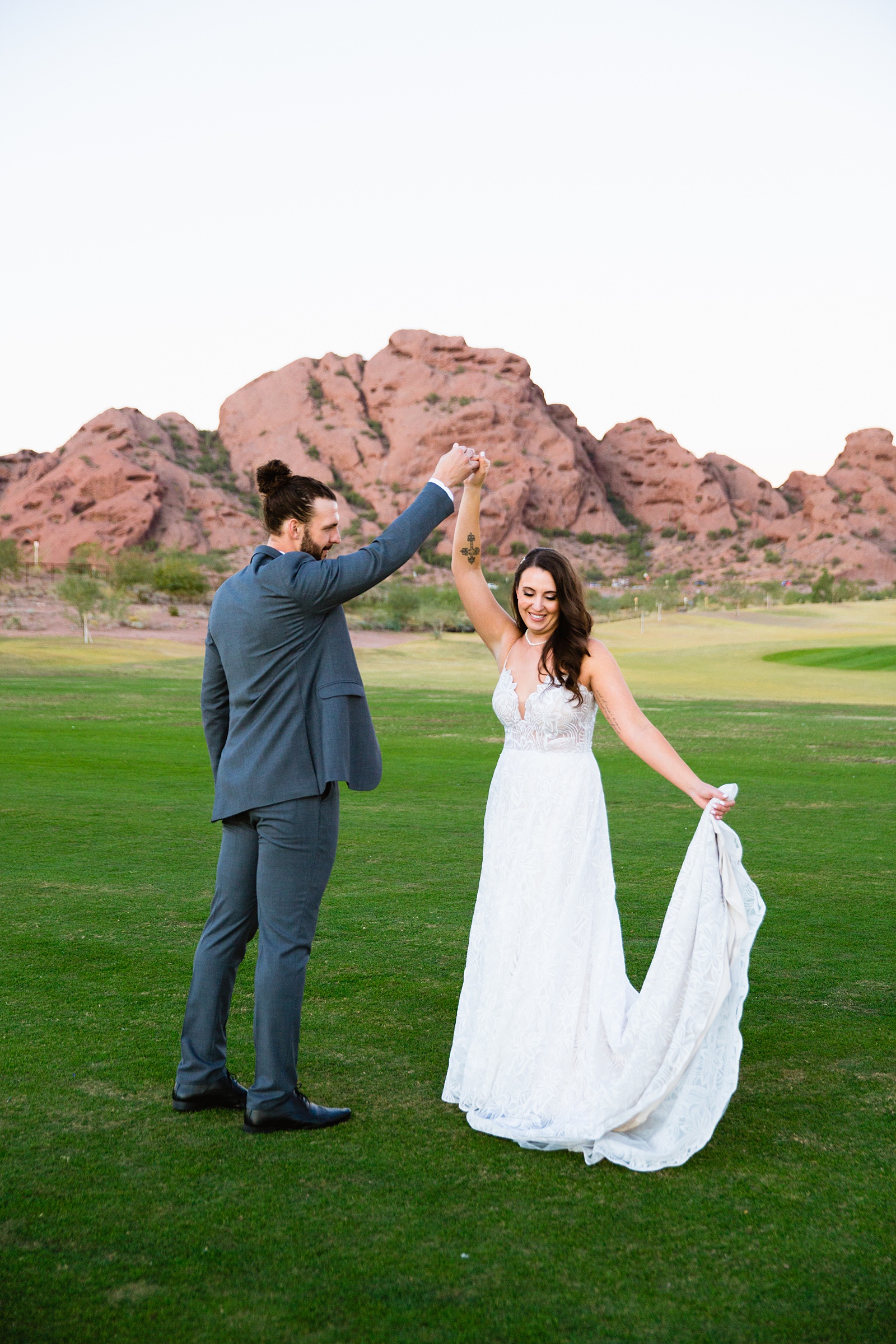 Bride and groom dancing together during their Papago Events wedding by Arizona wedding photographer PMA Photography.