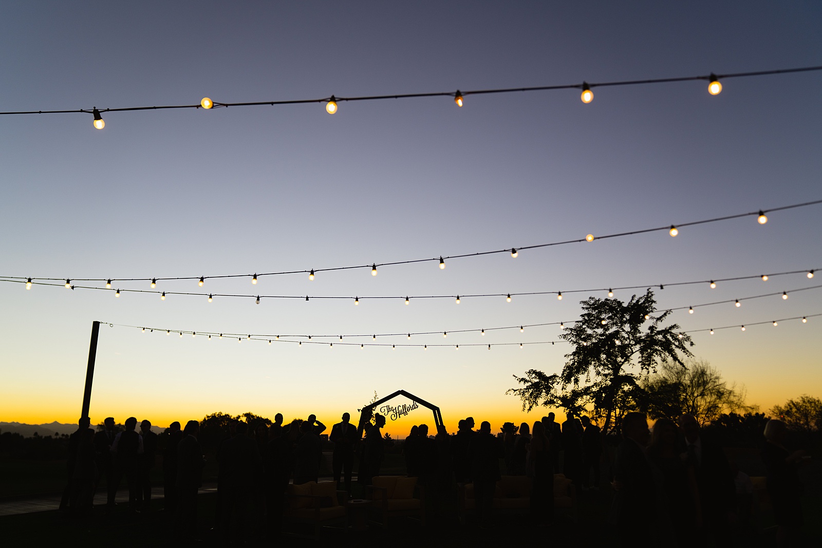Silhouette of cocktail hour at Papago Events by Phoenix wedding photographers PMA Photography.