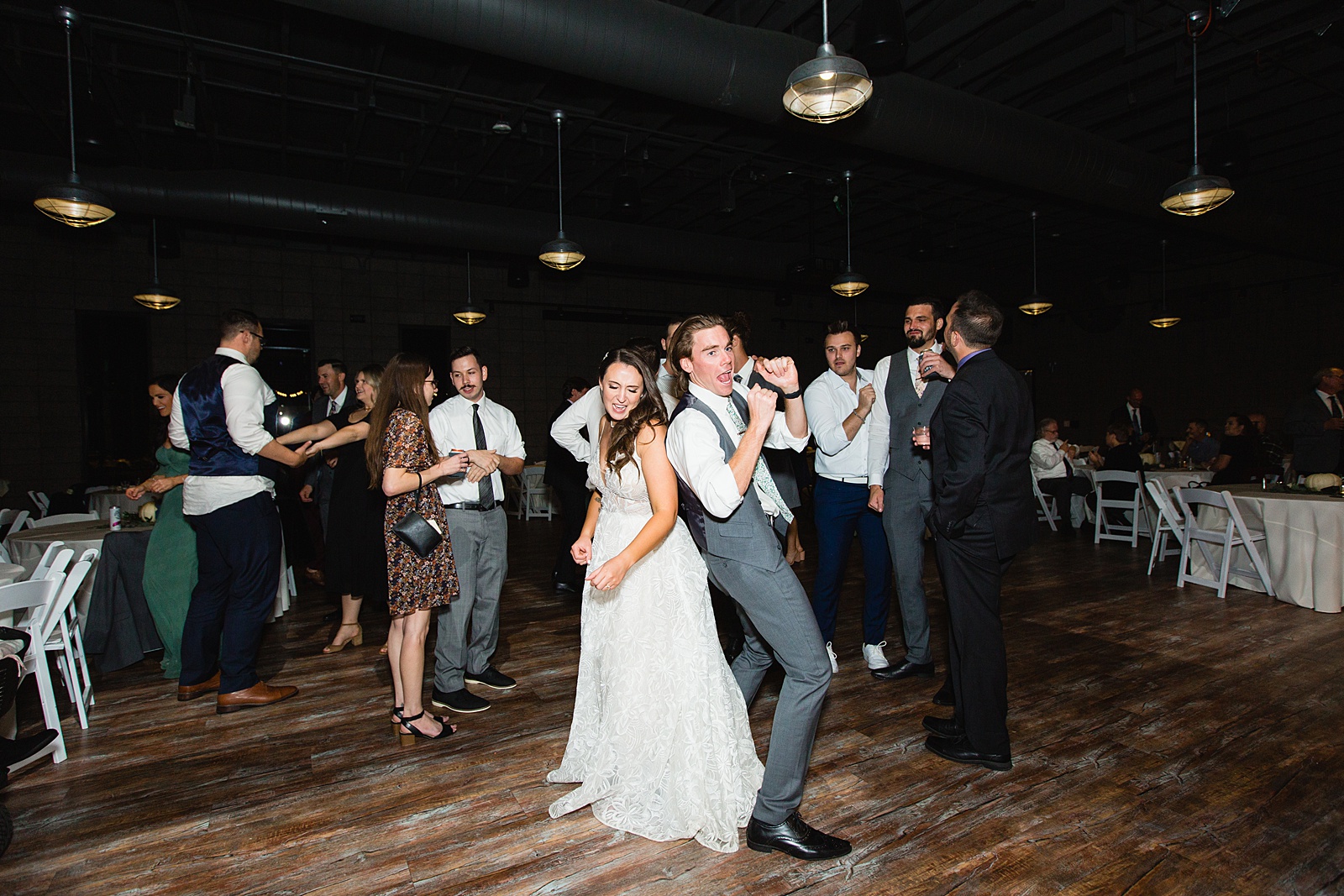 Bride dancing with guests at Papago Events wedding reception by Phoenix wedding photographer PMA Photography