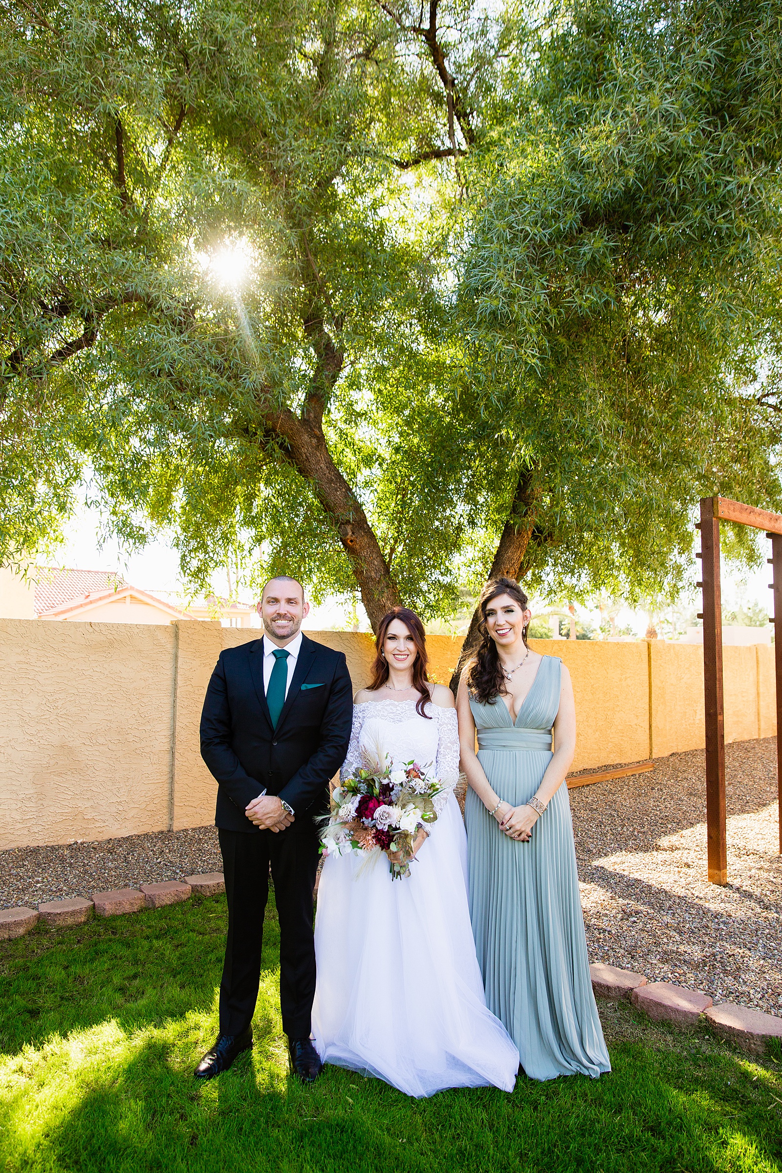 Bride and mixed gender bridal party together at a Backyard Micro wedding by Arizona wedding photographer PMA Photography.