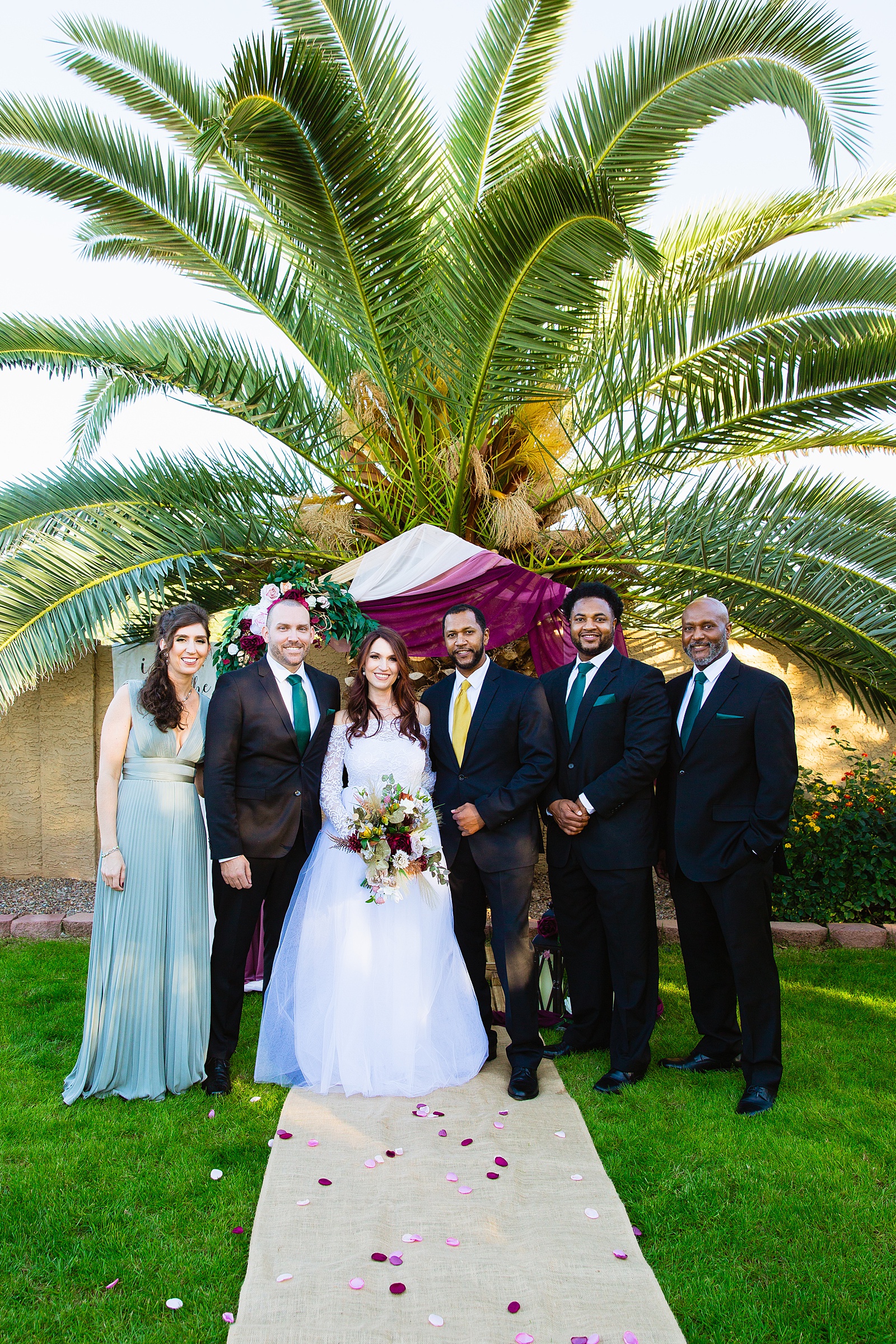 Mixed gender bridal party together at a Backyard Micro wedding by Arizona wedding photographer PMA Photography.