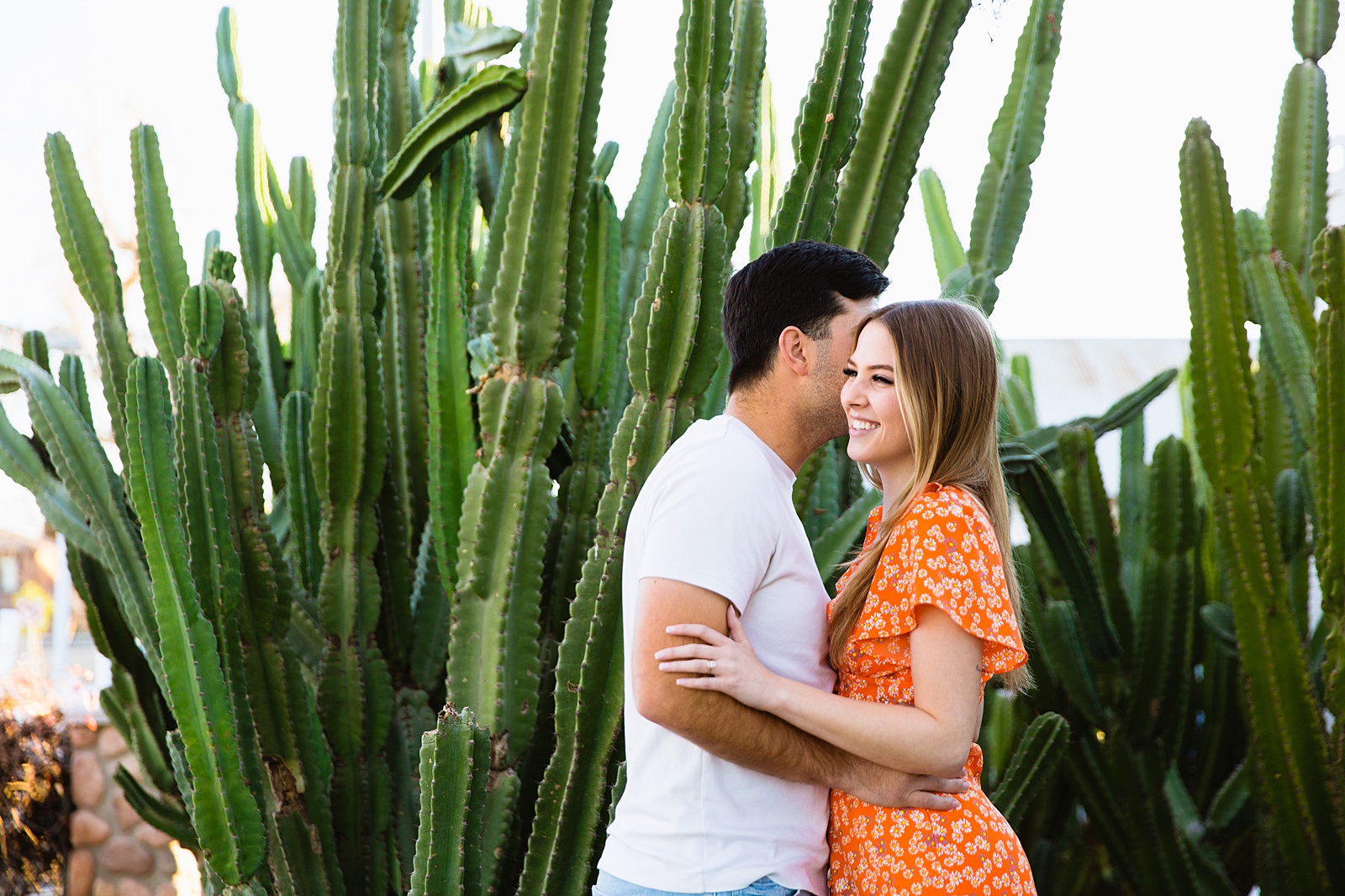 Couple share an intimate moment at their Gilbert engagement session by Arizona engagement photographer PMA Photography.