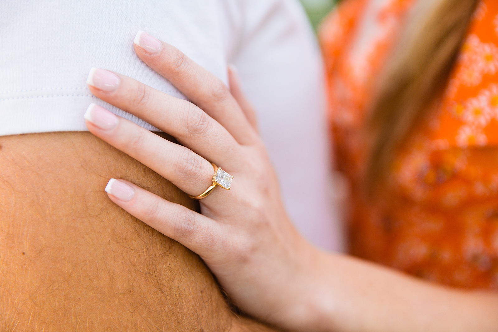Detail image of engagement ring during during engagement session by PMA Photography.