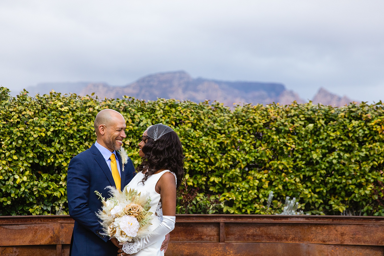Newlyweds looking at each other during their Agave of Sedona wedding by Sedona wedding photographer PMA Photography.