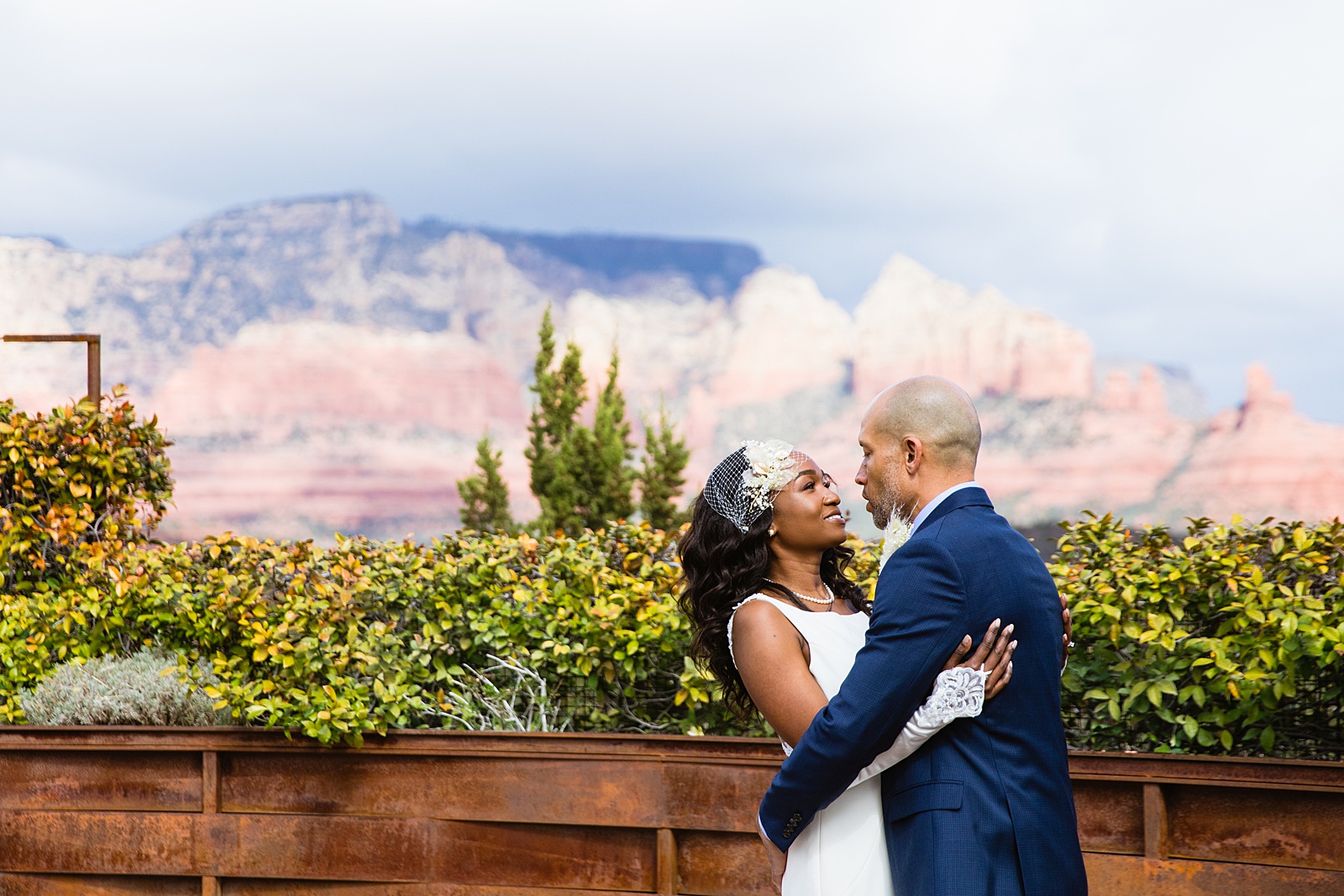 Newlyweds share an intimate moment at their Agave of Sedona wedding by Arizona wedding photographer PMA Photography.
