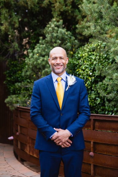 Groom's blue suit with yellow tie for his Agave of Sedona wedding by PMA Photography.