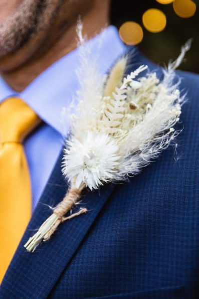 Groom's boho dried floral boutonniere by PMA Photography.