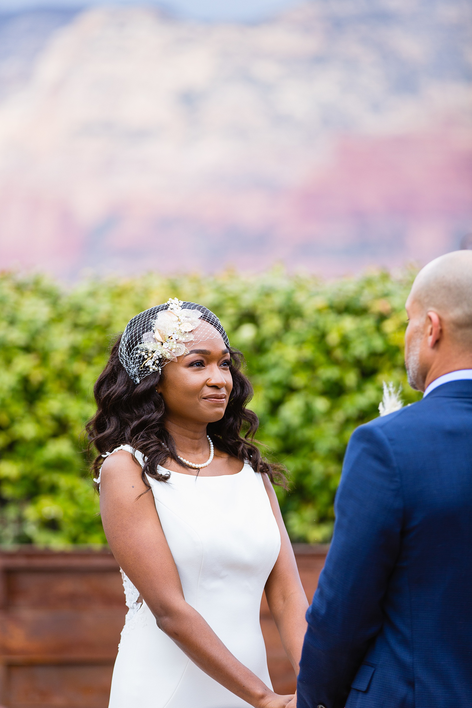 Bride looking at her groom during their wedding ceremony at Agave of Sedona by Sedona wedding photographer PMA Photography.