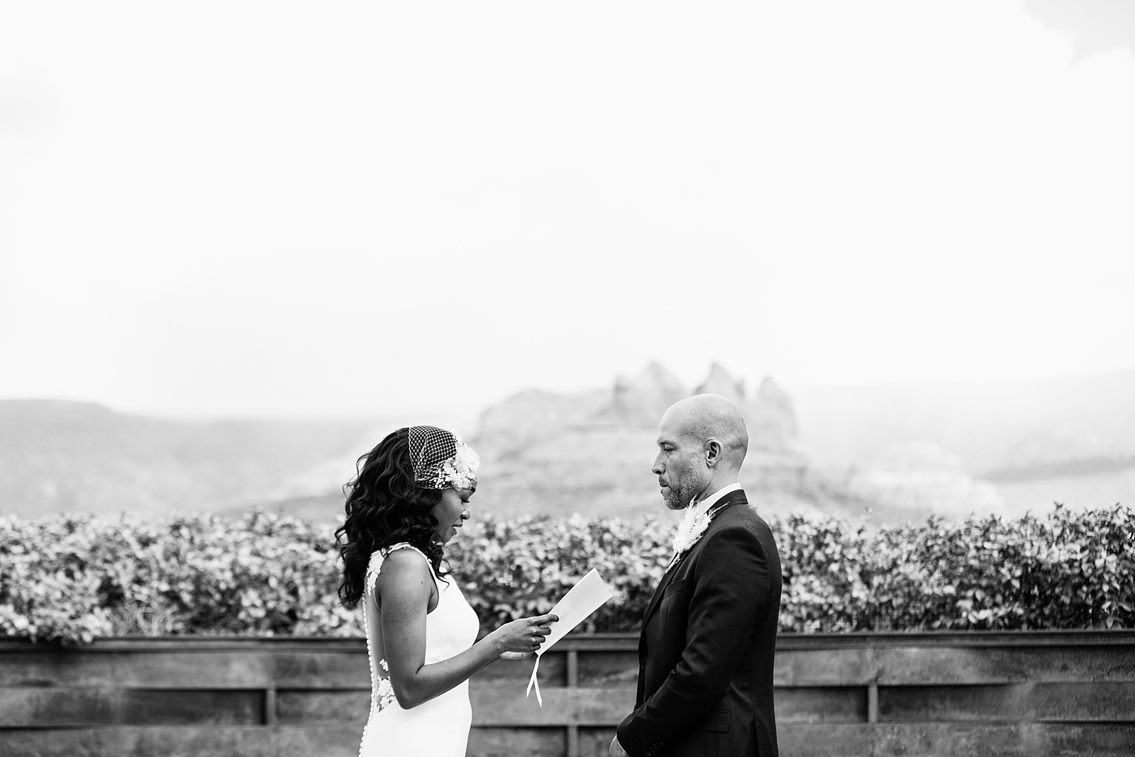 Bride and Groom exchange vows during their wedding ceremony at Agave of Sedona by Arizona wedding photographer PMA Photography.