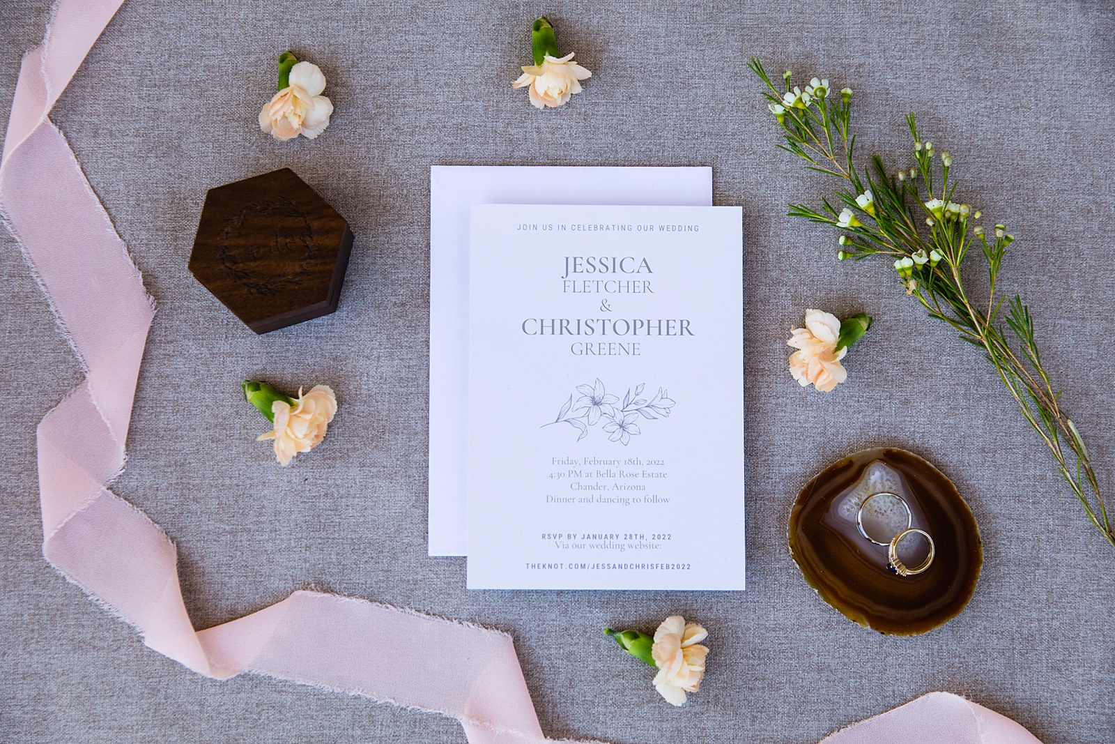 Romantic garden wedding invitations with rings and a ring box by Arizona wedding photographer PMA Photography.