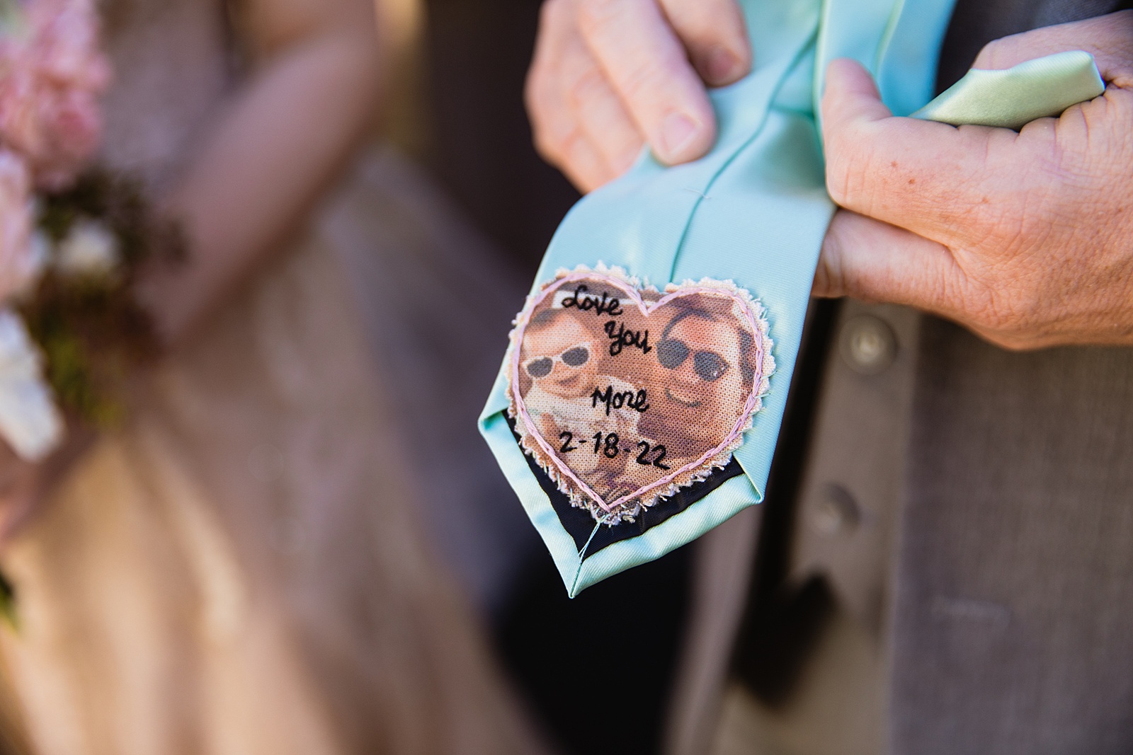 A picture of the bride and her father sewn into his tie for her wedding day by PMA Photography.