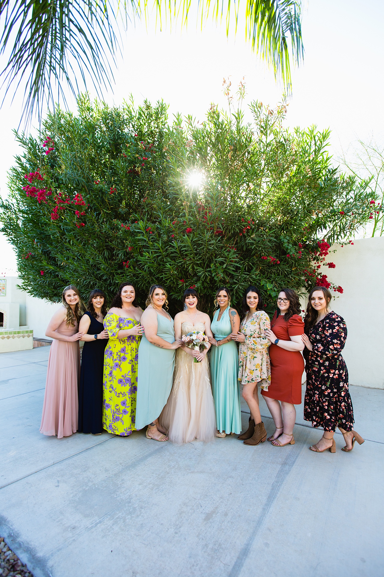 Bride and bridesmaids together at a Bella Rose Estate wedding by Arizona wedding photographer PMA Photography.