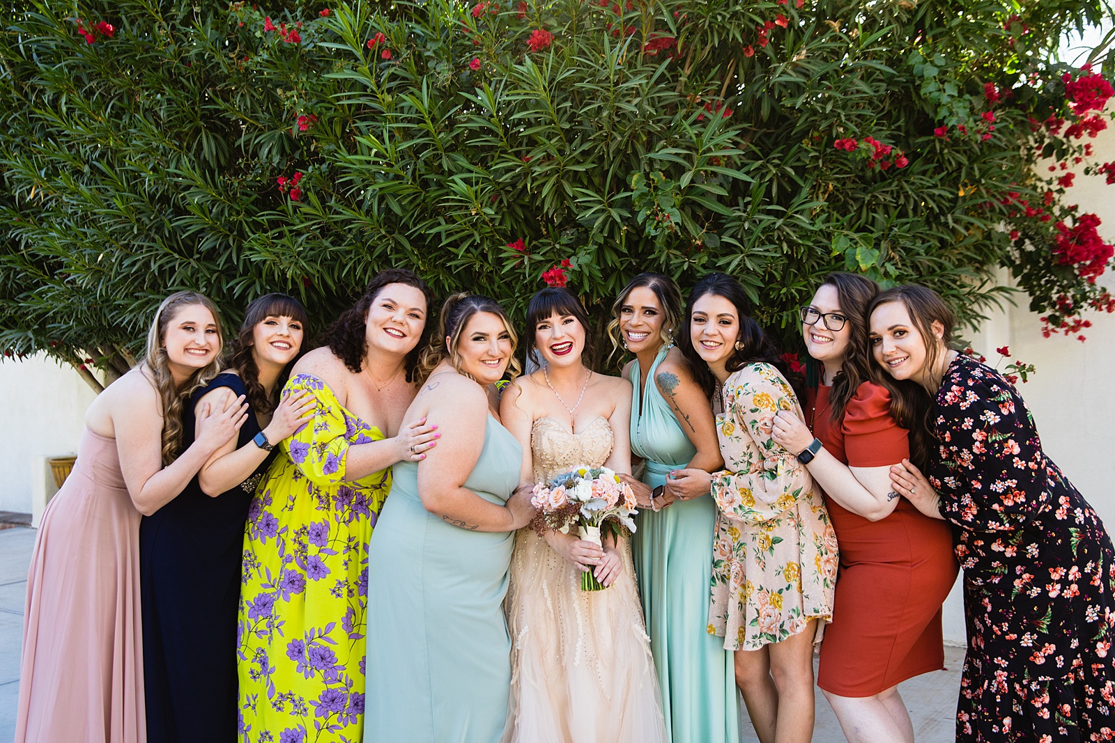 Bride and bridesmaids together at a Bella Rose Estate wedding by Arizona wedding photographer PMA Photography.