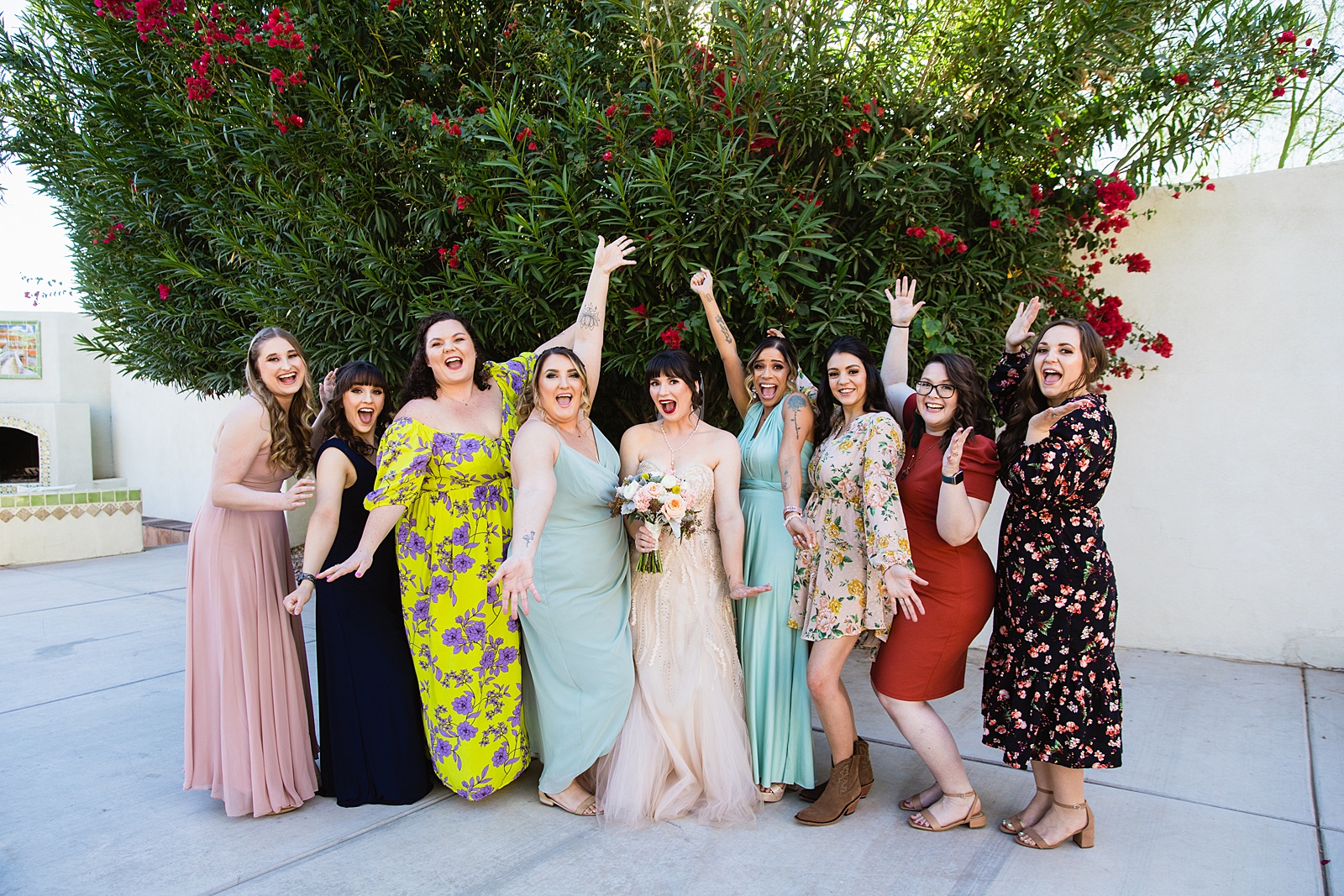 Bride and bridesmaids laughing together at Bella Rose Estate wedding by Chandler wedding photographer PMA Photography.