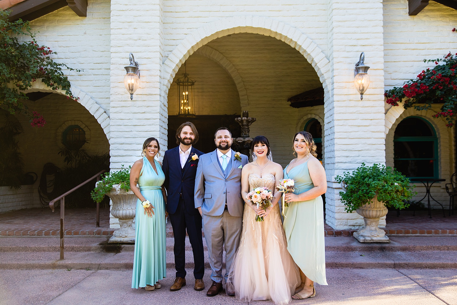 Bridal party together at a Bella Rose Estate wedding by Arizona wedding photographer PMA Photography.