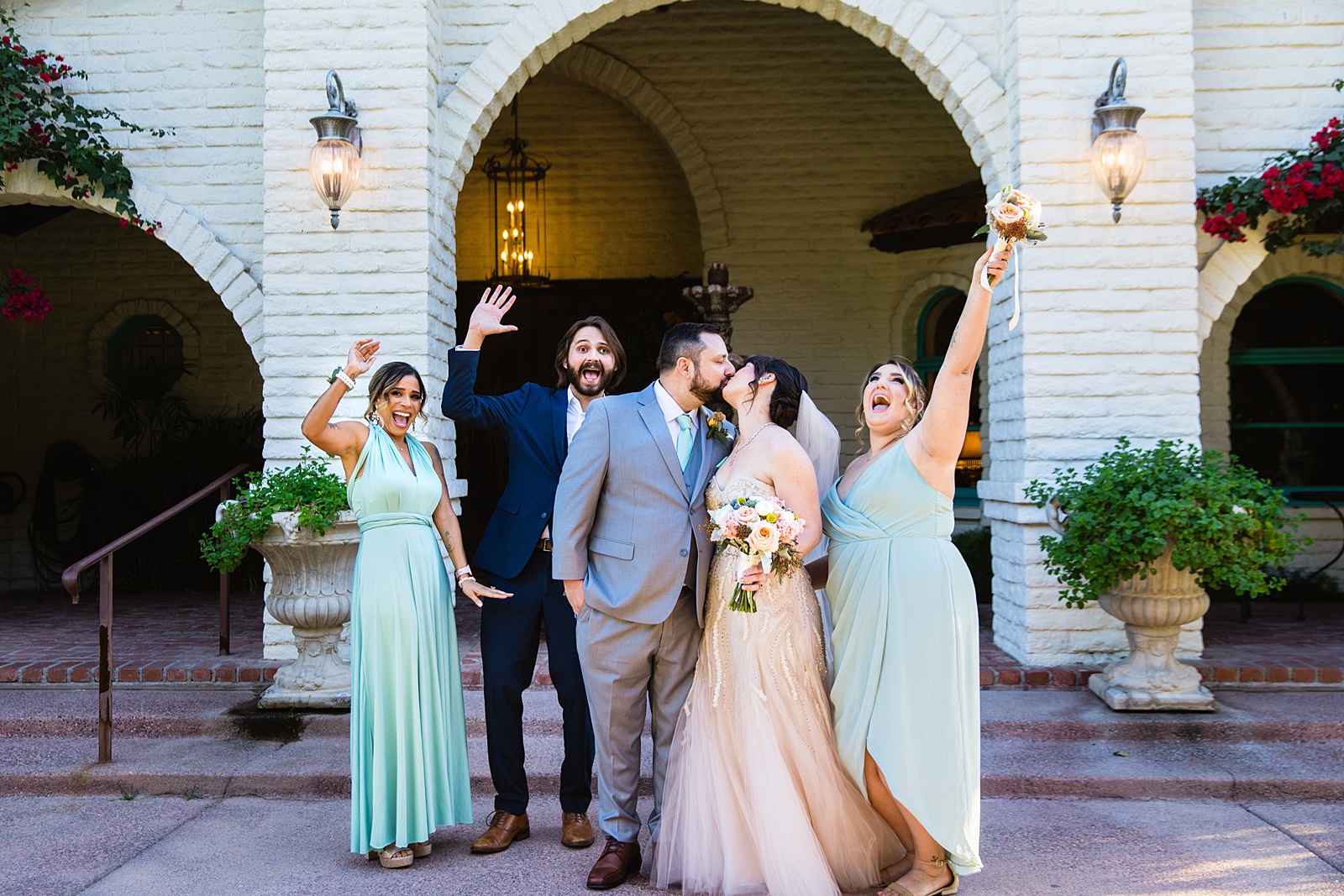 Bridal party having fun together at Bella Rose Estate weding by Arizona wedding photographer PMA Photography.