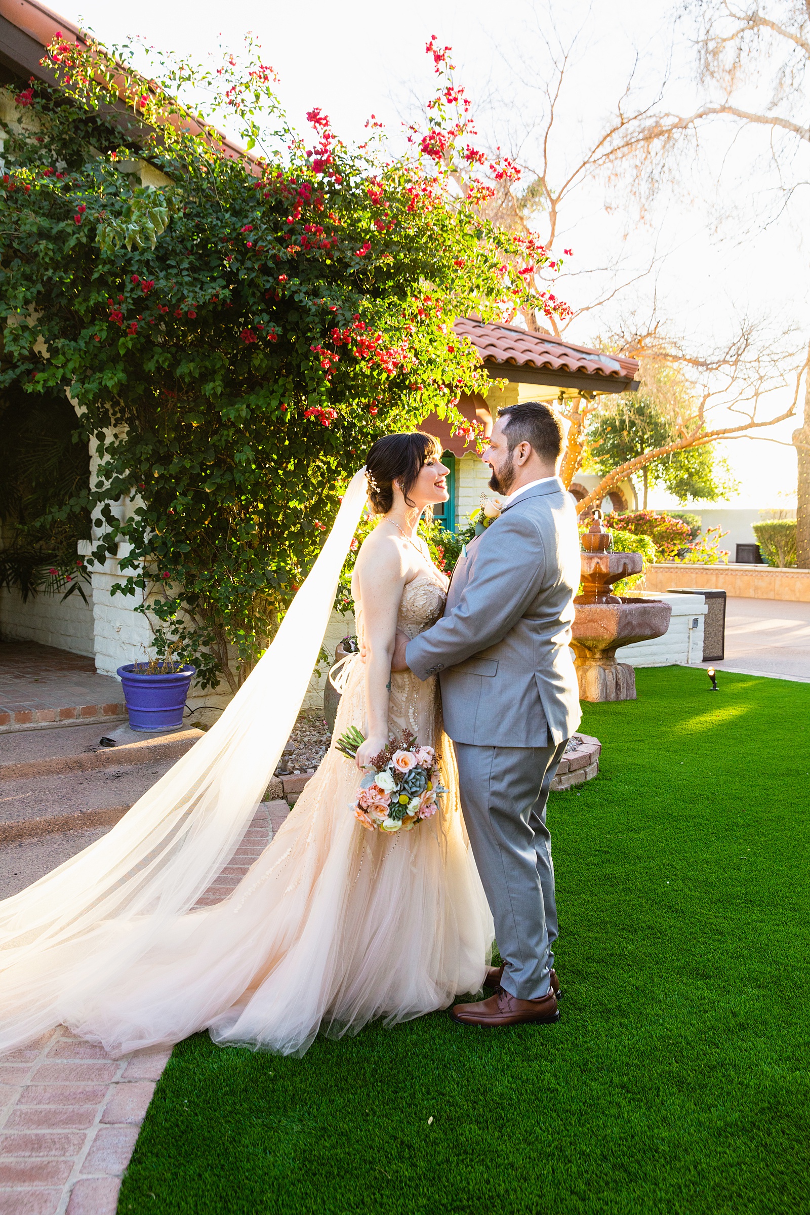 Bride and Groom pose during their Bella Rose Estate wedding by Arizona wedding photographer PMA Photography.