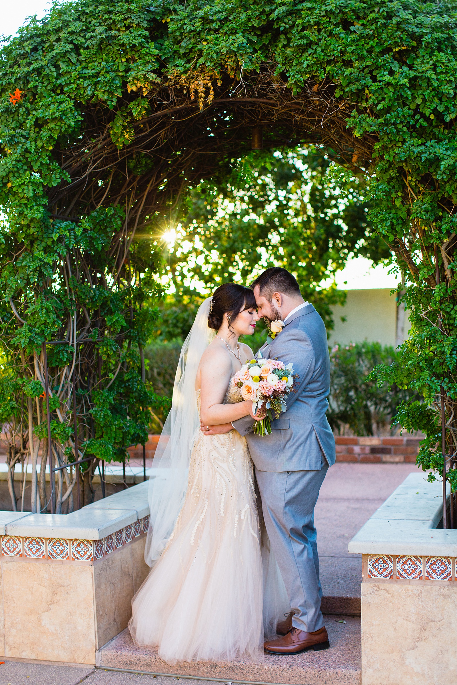 Bride and Groom share an intimate moment at their Bella Rose Estate wedding by Arizona wedding photographer PMA Photography.