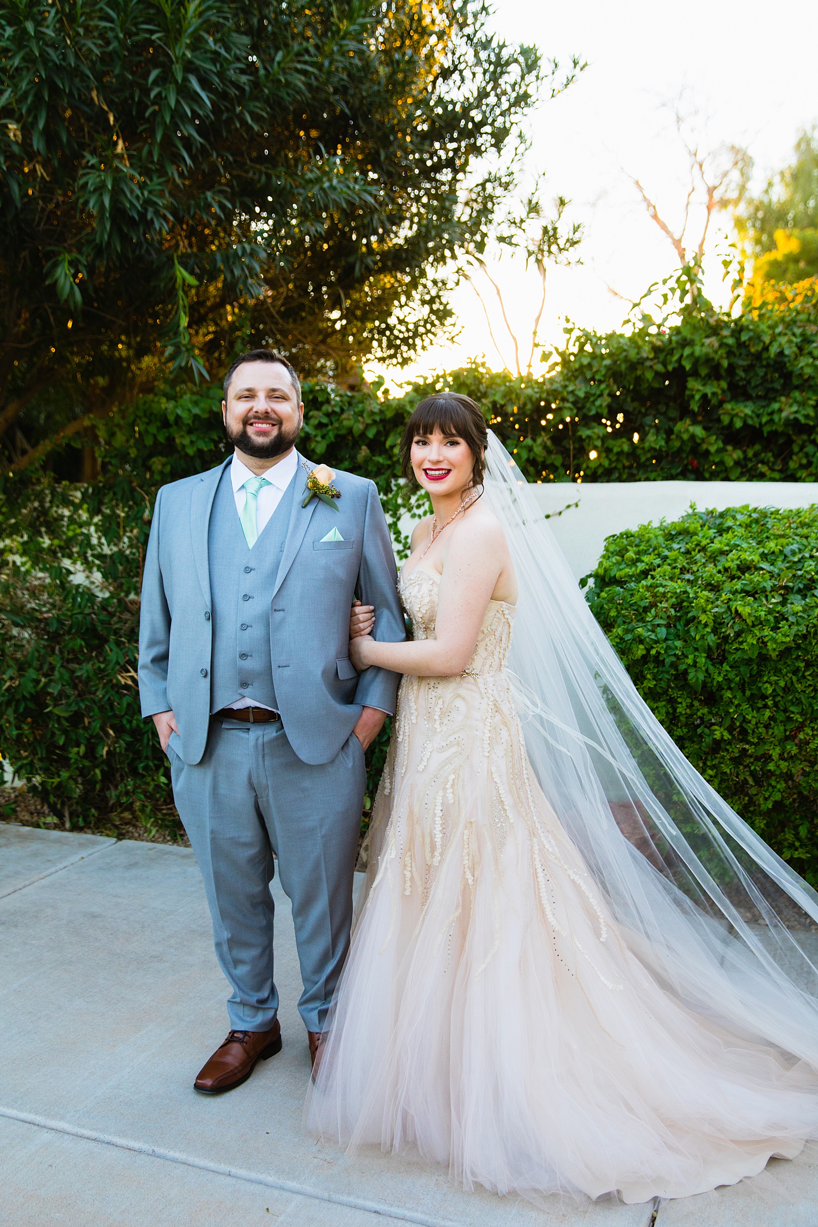 Bride and Groom pose during their Bella Rose Estate wedding by Arizona wedding photographer PMA Photography.