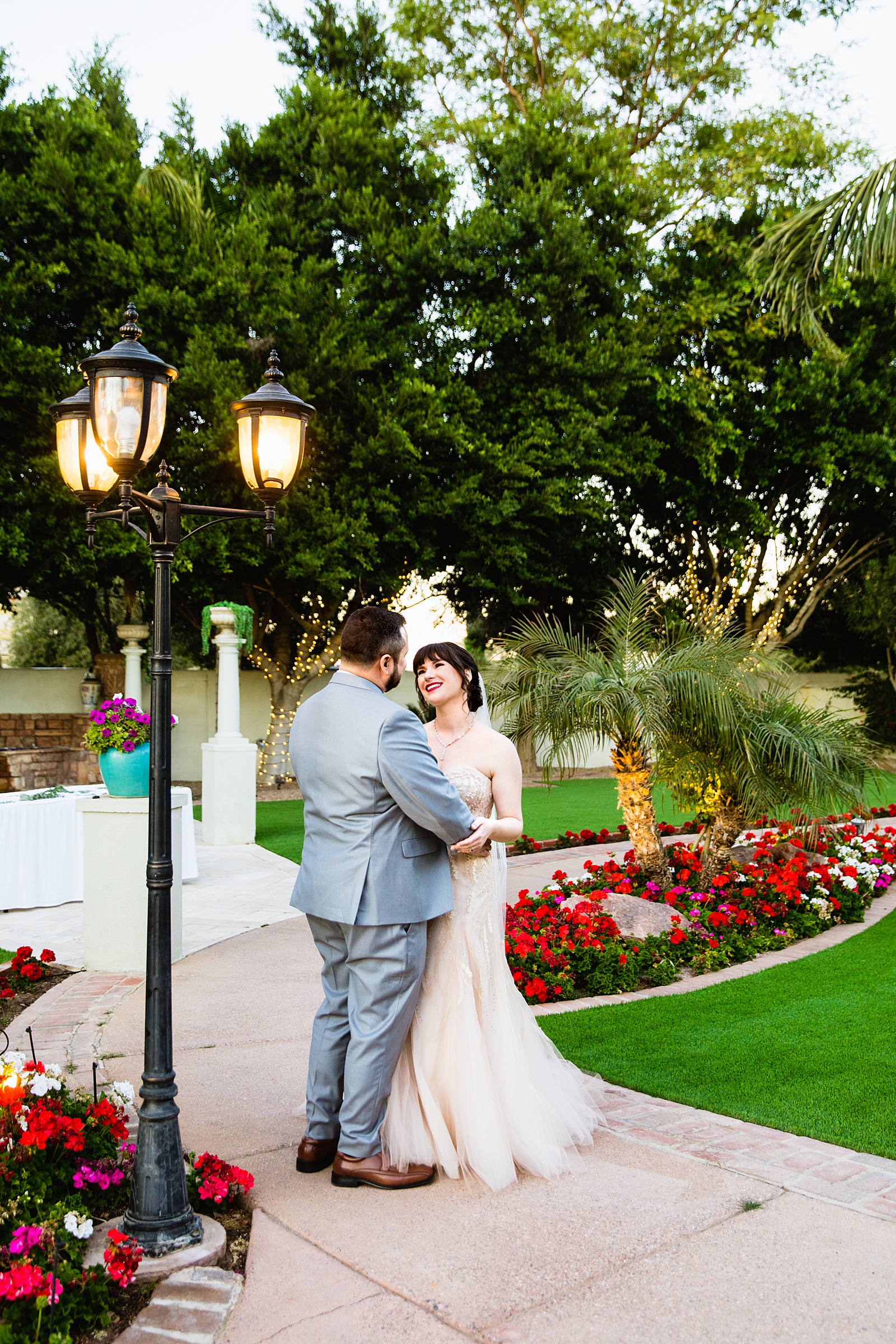 Bride and Groom pose for their Bella Rose Estate wedding by Chandler wedding photographer PMA Photography.