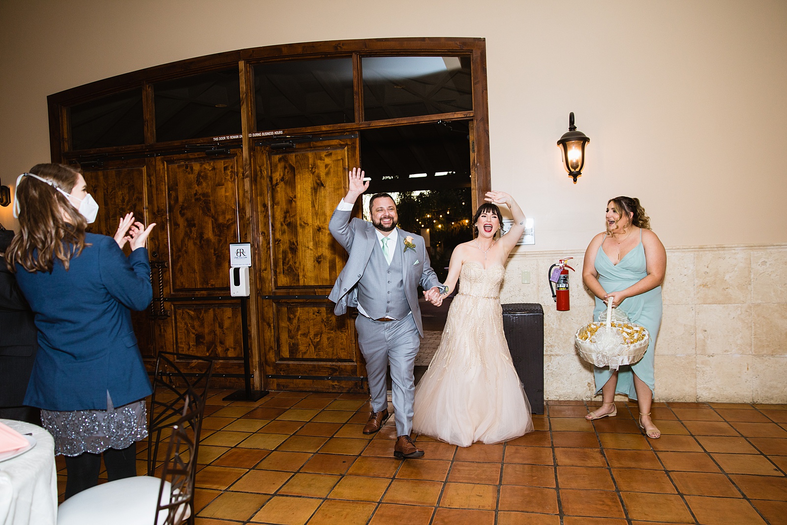 Couple's grand entrance at Bella Rose Estate wedding reception by Chandler wedding photographer PMA Photography.