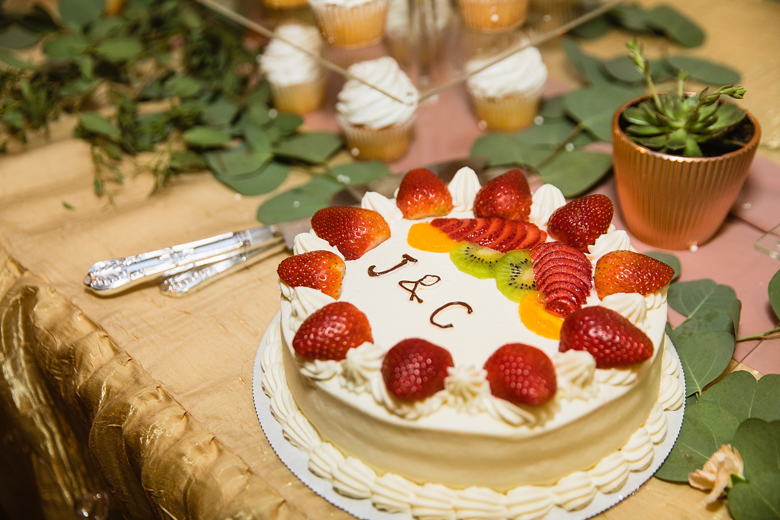 Simple wedding cake with fruit by PMA Photography.